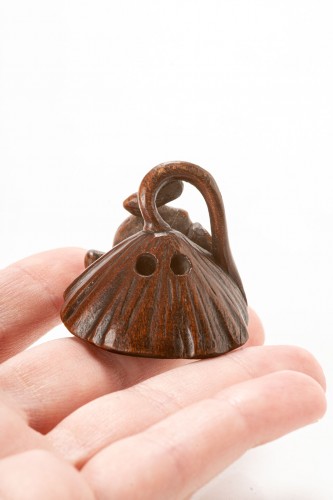  - A Japanese boxwood netsuke of a toad on a lotus flower with a spider