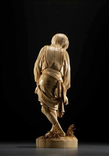 19th century - A Japanese Tokyo school ivory okimono depicting a young boy