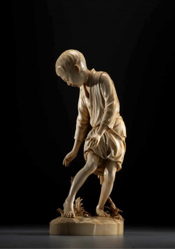 A Japanese Tokyo school ivory okimono depicting a young boy - 