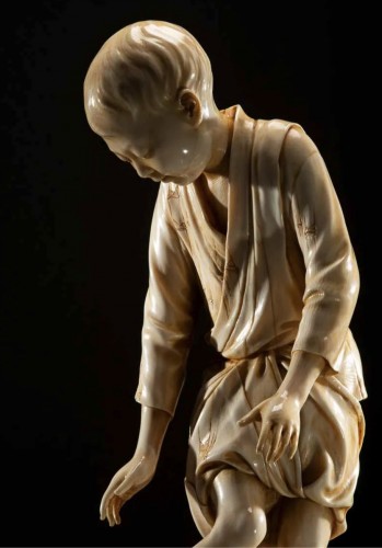  - A Japanese Tokyo school ivory okimono depicting a young boy