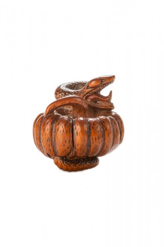 A Boxwood Netsuke Depicting A Snake Wrapping Around A Pumpkin