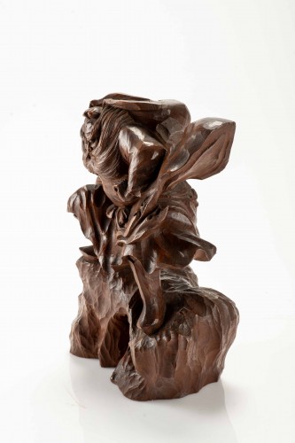 A Boxwood Okimono Depicting Shoki Attempting To Surprise An Oni - 