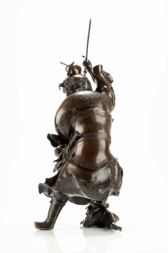 Asian Works of Art  - A Bronze Sculpture Depicting Shoki With A Pair Of Oni