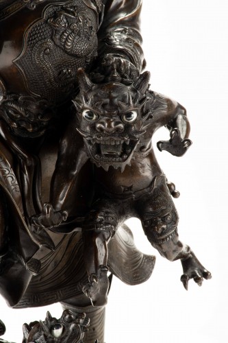 A Bronze Sculpture Depicting Shoki With A Pair Of Oni - 