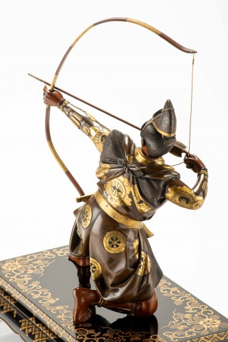  - A bronze okimono depicting a samurai with a bow, signed Yoshimitsu