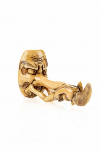 A shunga ivory netsuke depicting a monk seated on the nose of Tengu - Asian Works of Art Style 