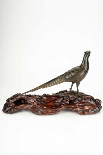  - A japanese gilt and patinated bronze okimono of a pheasant