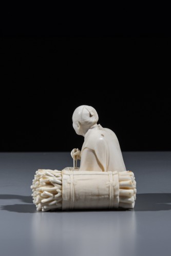 An ivory okimono depicting a woodcutter  - Asian Works of Art Style 