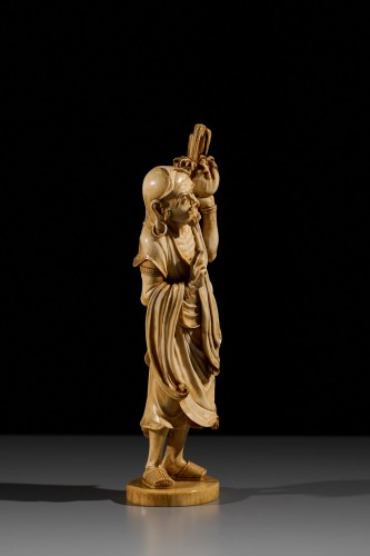An Ivory Okimono Of A Rakan Holding A Ritual Vase, Signed Kazutoshi - Asian Works of Art Style 