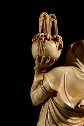  - An Ivory Okimono Of A Rakan Holding A Ritual Vase, Signed Kazutoshi
