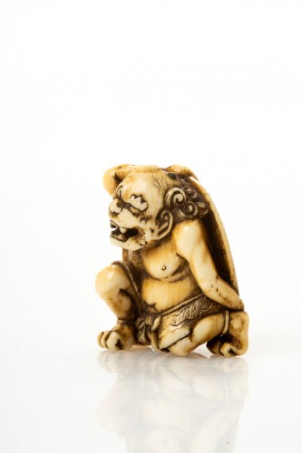 Asian Works of Art  - Tomomitsu – A Japanese ivory netsuke of an Oni