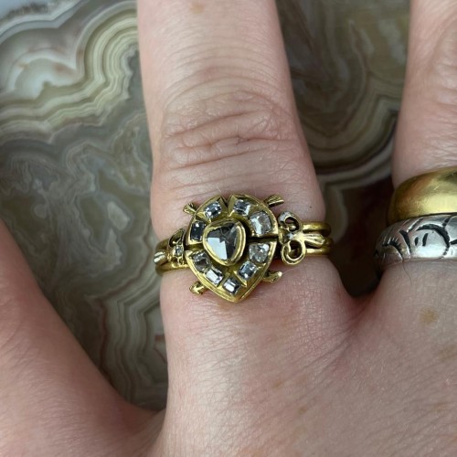 17th century -  Puzzle Ring With A Diamond Heart Shot By Cupid. Western Europe, 17th Centu