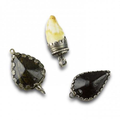 Three silver mounted amulets. German, 17/18th centuries. - 