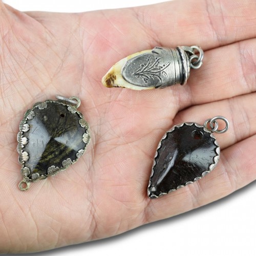 18th century - Three silver mounted amulets. German, 17/18th centuries.
