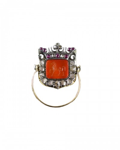 Swivelling diamond and ruby cluster ring, mid 19th century.
