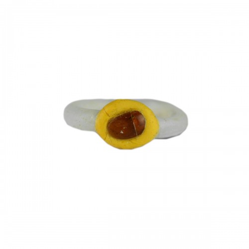 White glass ring with a yellow bezel and amber bead. Roman, 2nd-3rd Century