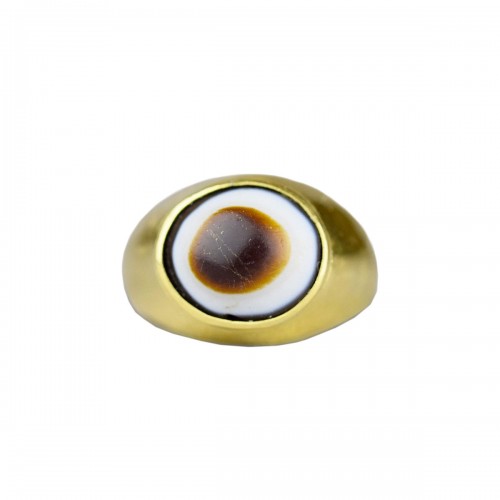 Amuletic high carat gold ring set with an ancient apotropaic ‘eye’.