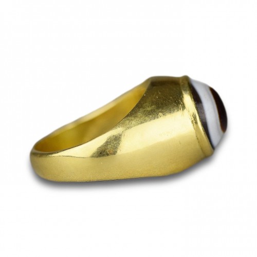  - Amuletic high carat gold ring set with an ancient apotropaic ‘eye’.