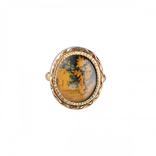 Gold ring set with a micro-wood carving. French, 18th century.