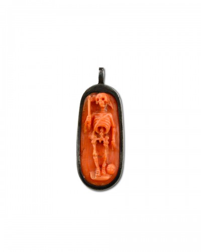 Silver pendant with a coral memento mori cameo