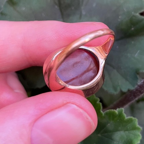  - Gold ring with a Roman intaglio of a seated Minerva before a trophy of armo