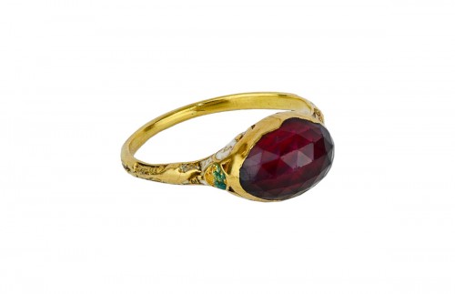 Gold and enamel ring set with a faceted garnet