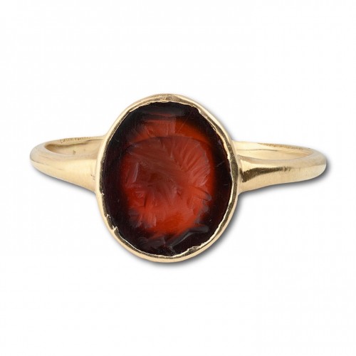 Gold ring with a carnelian intaglio of Zeus-Serapis, Roman, 1st - 2nd centu - 