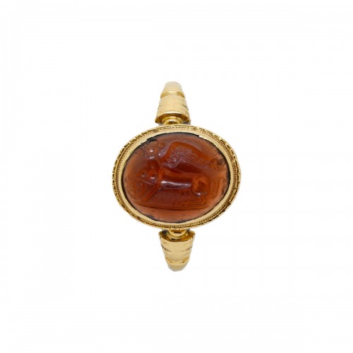Gold ring with a cabochon garnet intaglio of a sphinx