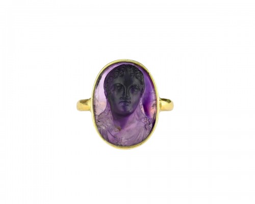 Gold ring set with a 19th century amethyst cameo of a muse