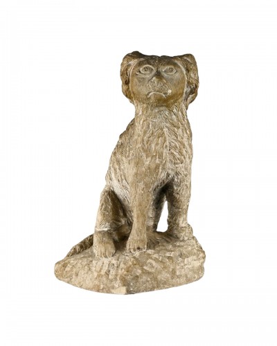 Primitive limestone sculpture of a seated spaniel, England 17th / 18th century