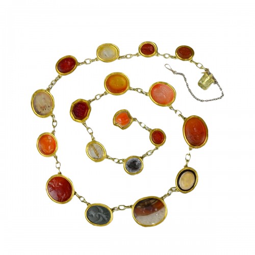 Classical revival necklace set with eighteen ancient hardstone intaglios.  