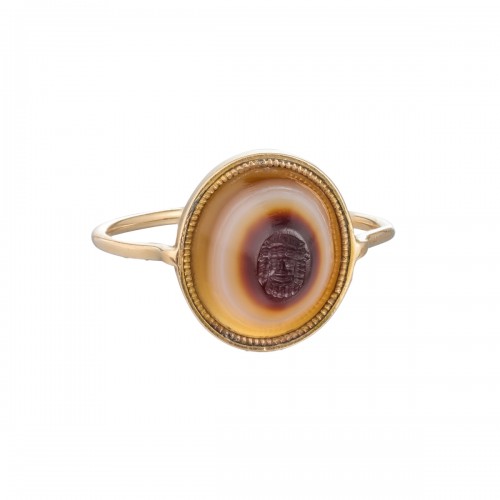 Georgian gold ring with an ancient banded agate intaglio of a Bacchic mask.