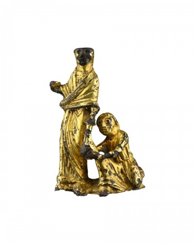 Gilt-Bronze Group Depicting an Act of Almsgiving. England, early 12th centu