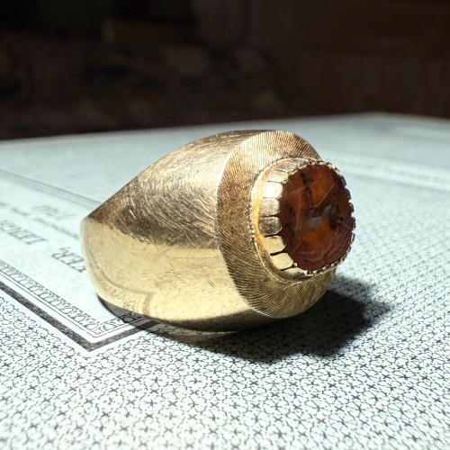 Gold Ring Set with an Ancient Carnelian Scarab Depicting a Deer Hunt. - 