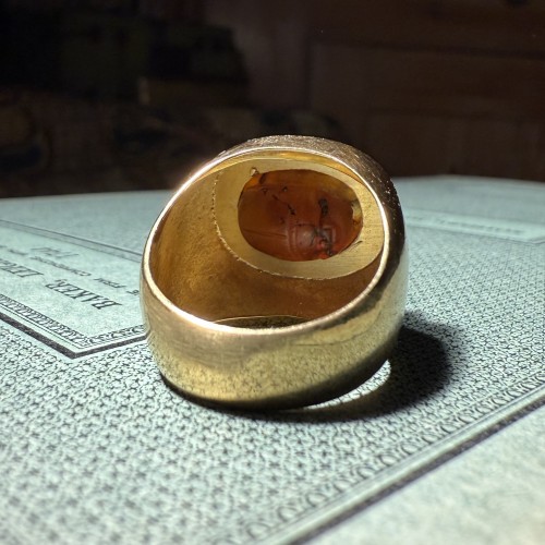 Gold Ring Set with an Ancient Carnelian Scarab Depicting a Deer Hunt. - 