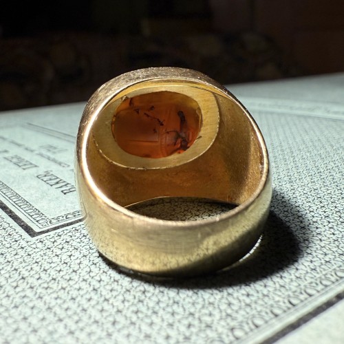  - Gold Ring Set with an Ancient Carnelian Scarab Depicting a Deer Hunt.