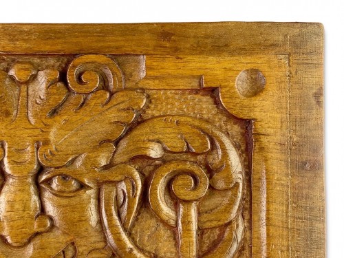  - Pair of walnut panels carved with mascarons. French, late 16th century.