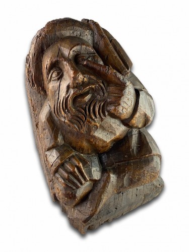 Corbel of a seated man in fashionable clothing. Northern France, 15th centu