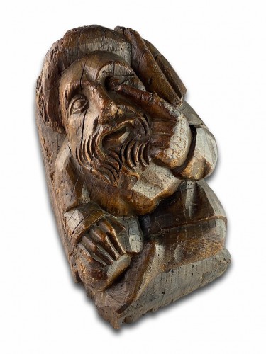 11th to 15th century - Corbel of a seated man in fashionable clothing. Northern France, 15th centu