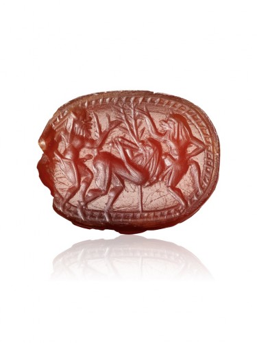 Antique Jewellery  - Cornelian scarab carved with frolicking Satyrs. Greek, Archaic period, c. 5