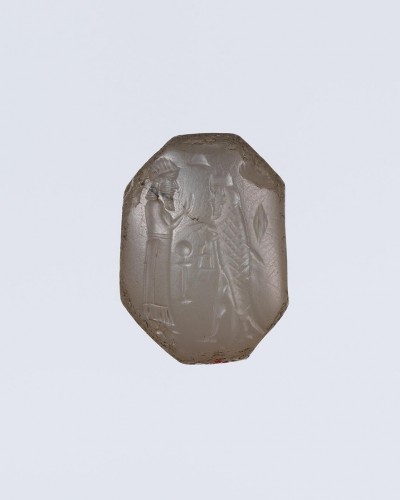 BC to 10th century -  A bluish-grey chalcedony stamp seal with a cultic scene. 