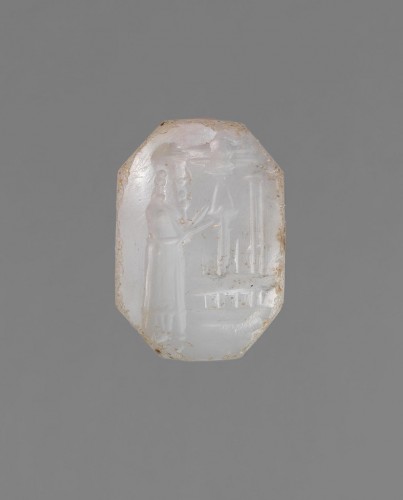  A bluish-grey chalcedony stamp seal with a cultic scene.  - 