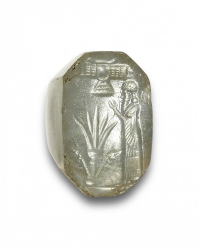  -  A bluish-grey chalcedony stamp seal with a cultic scene. 