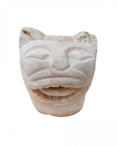 Romanesque stone fountain head in the form of a cat. English, 12th century.
