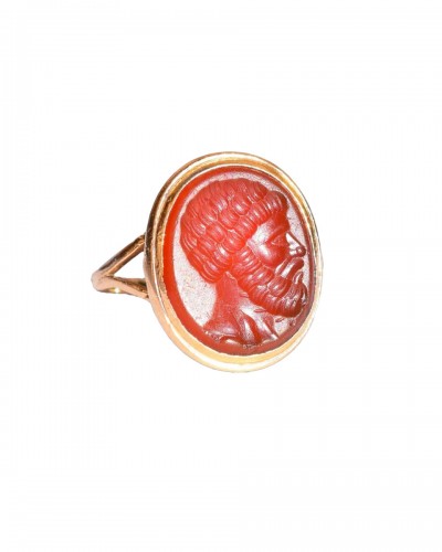 18th century gold ring set with a carnelian intaglio of a Roman bust.