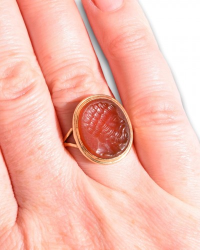 18th century gold ring set with a carnelian intaglio of a Roman bust. - 