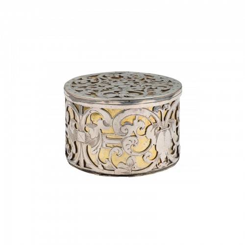 A circular strapwork Box, silver and parcel gilt, Dutch c.1660