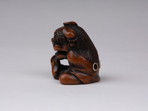 A wooden model Netsuke  by Sukeyuki of a shishimai performer. Japan Edo - 