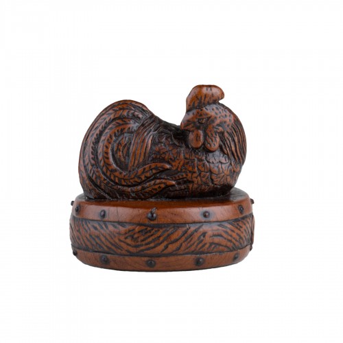 Netsuke by Tametaka. A wood model depicting a rooster