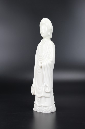 Asian Works of Art  - A Dehua Blanc de Chine standing figure of a lady, Kangxi period